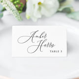 folded place card with elegant black calligraphy script