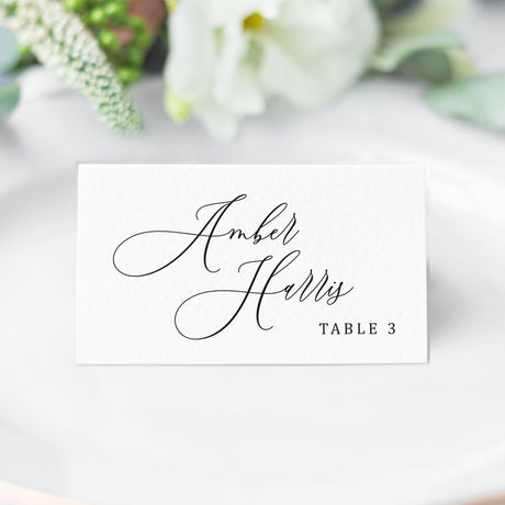 folded place card with elegant black calligraphy script