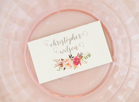 escort card printed on off white cardstock with taupe calligraphy font and pink watercolor rose bouquet