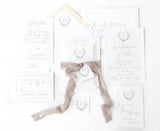 fine art wedding invitation set with handtorn edges, vintage crest and gray ribbon